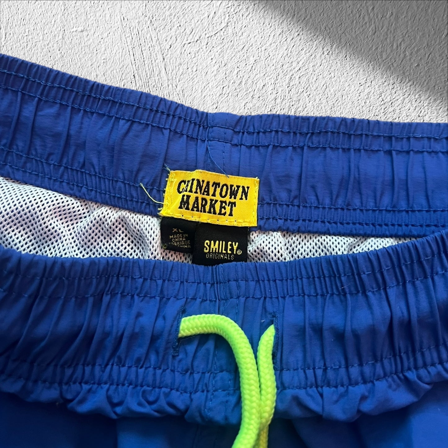 Chinatown Market Smiley Blue Swimming Trunks – Size XL